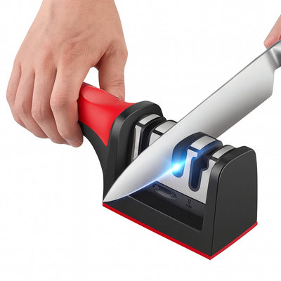 Knife sharpener with a hand holding a knife against it on a white background
