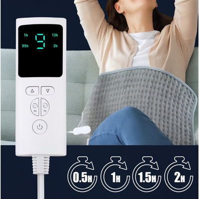 Person using a heating pad with a digital controller displaying time settings.