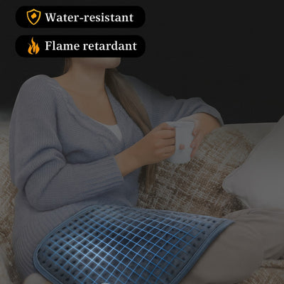 Woman sitting on a textured surface wearing a blue mesh seat cover with text indicating water-resistant and flame retardant properties.