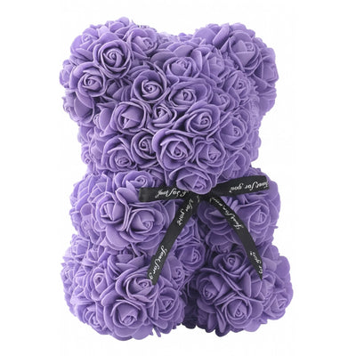 Purple teddy bear made of roses with a black ribbon on a white background