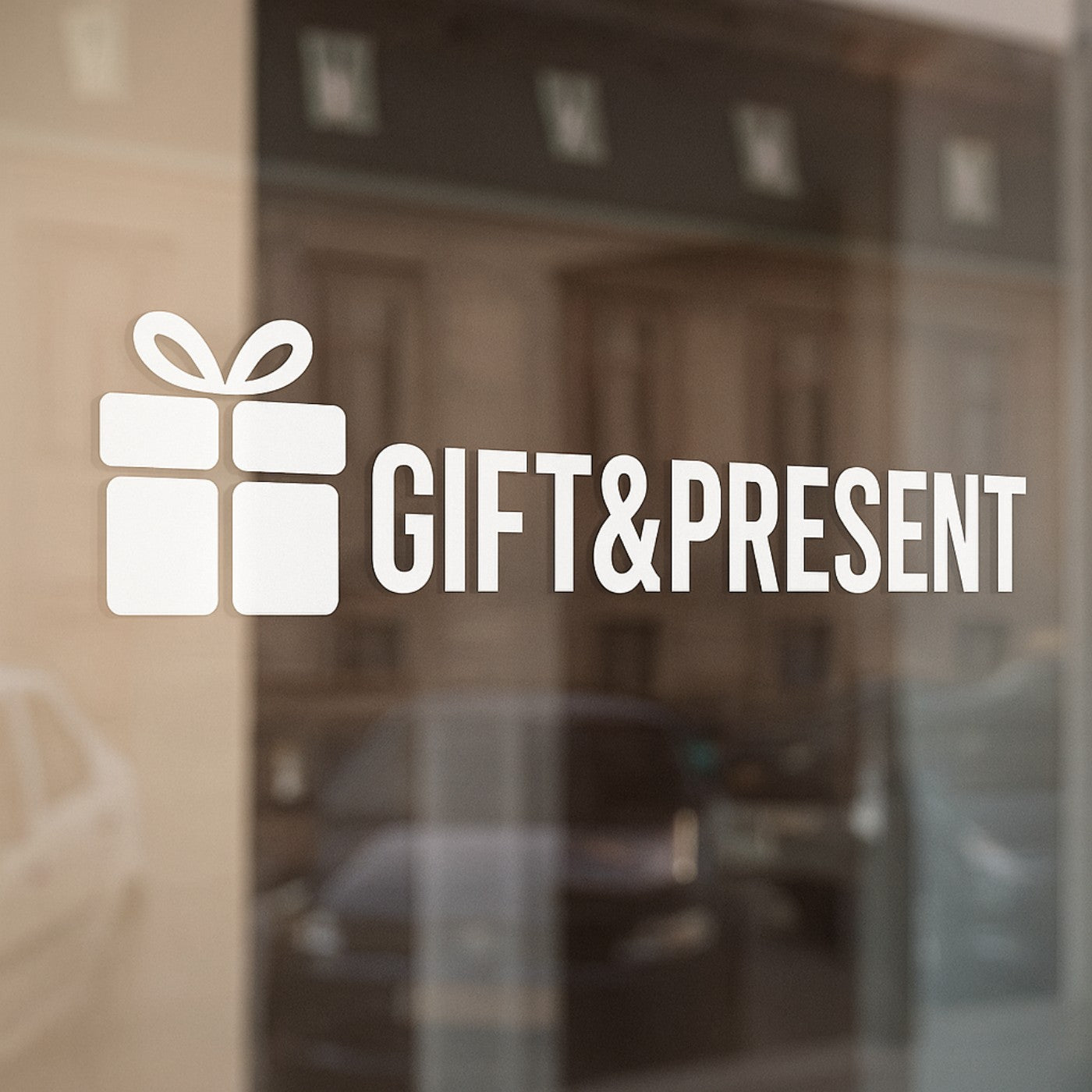 Storefront with 'Gift & Present' logo on glass door