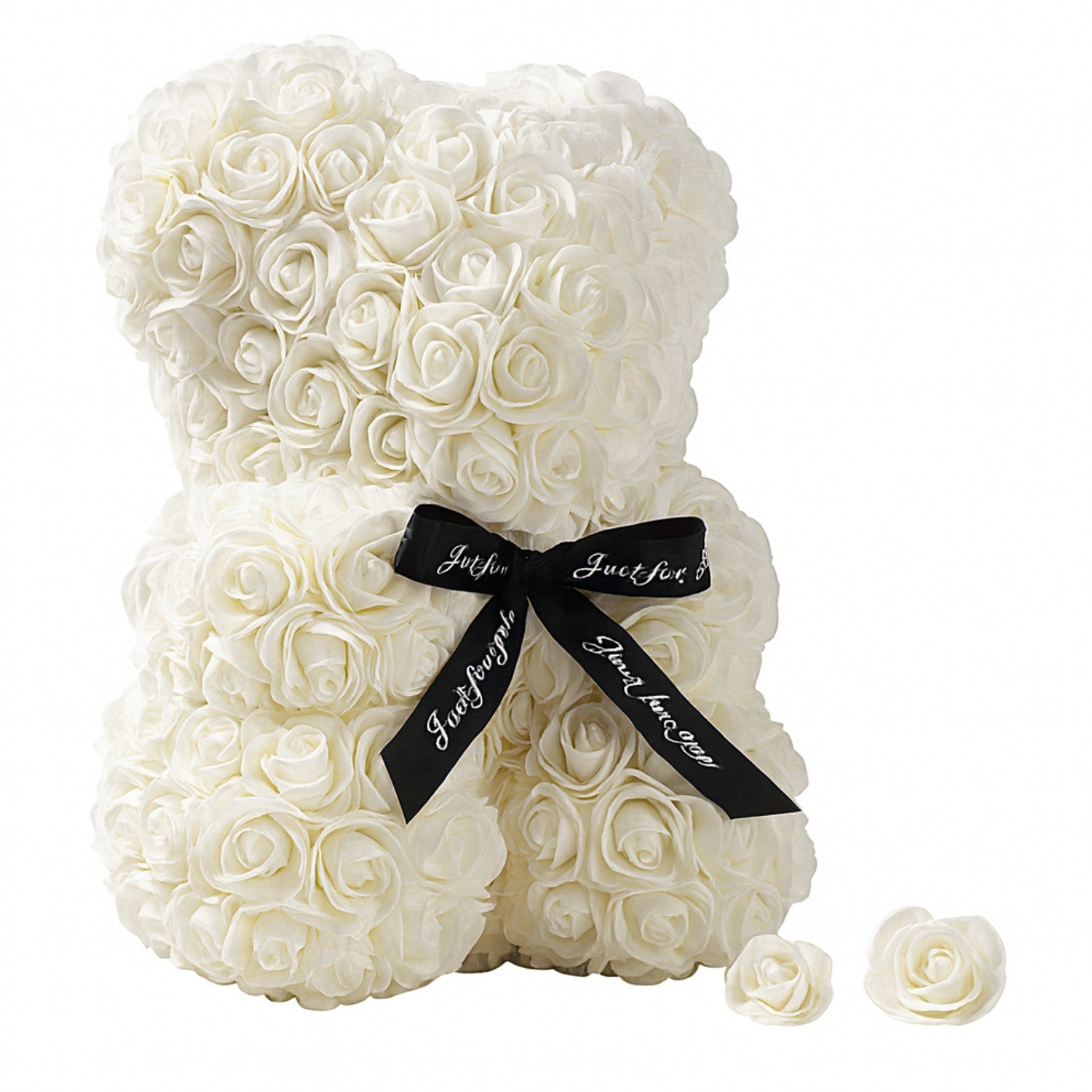 White rose teddy bear with a black ribbon on a white background